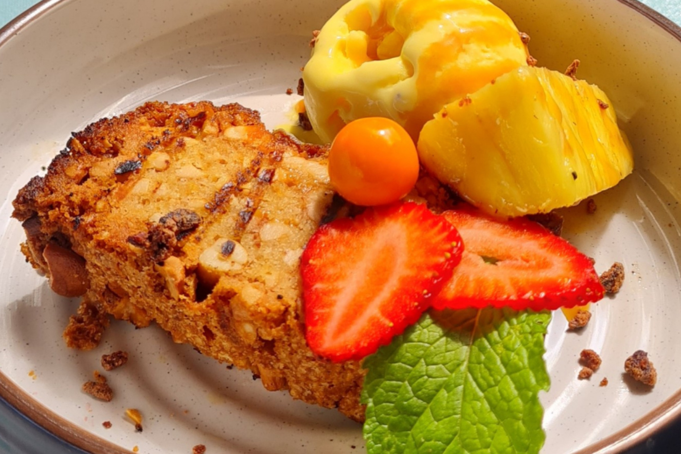 The charming whitewashed main building of Finca Rosa Blanca surrounded by tropical gardens