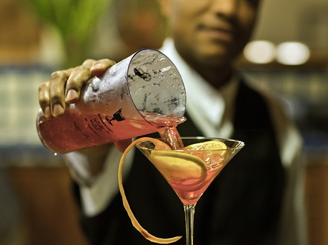 Bartender pouring a cocktail