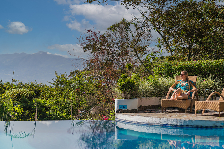 woman at Finca Rosa Blanca pool